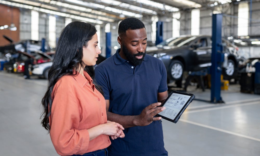 Franklin Ford Service Technician sharing information with the customer