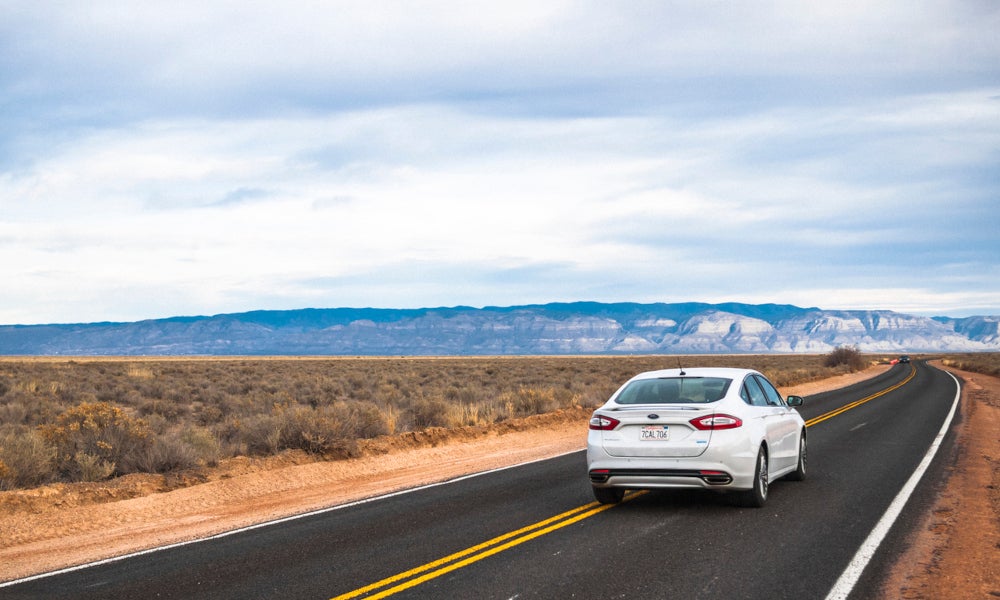 Ford vehicle driving on the road